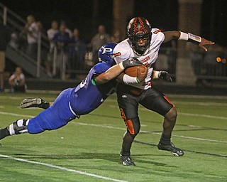 Poland's Pad O'Shaugnessy (55) sacks Howland quarterback Samari Dean (1) during the second quarter of Friday nights matchup at Poland High School.   Dustin Livesay  |  The Vindicator  9/16/16  Poland Seminary High School.