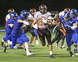 Howland's Victor Williams (20) returns a kickoff to midfield before being brought down by a host of Poland defenders during the third quarter of Friday nights matchup at Poland High School.   Dustin Livesay  |  The Vindicator  9/16/16  Poland Seminary High School.