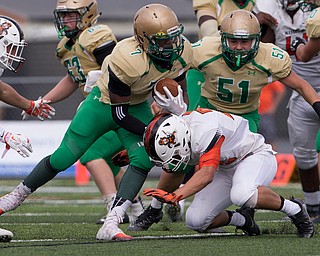 MICHAEL G TAYLOR | THE VINDICATOR- 9-17-16- 1st qtr., after picking up the 1st down, Ursuline's #7 Joe Floyd is tackled by Massillon's #32 Kordell Ford. Massillon-Washington Tigers vs Youngstown Ursuline Irish at Mollenkopf Stadium in Warren, OH.