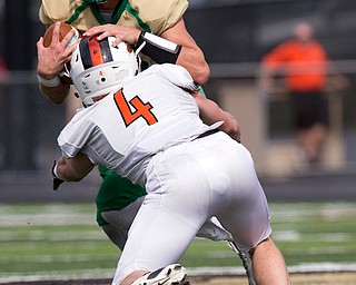 MICHAEL G TAYLOR | THE VINDICATOR- 9-17-16-1st qtr., Ursuline's #13 Jared Fabry is stopped by  Massillon's #4 Jacob Risher. Massillon-Washington Tigers vs Youngstown Ursuline Irish at Mollenkopf Stadium in Warren, OH.