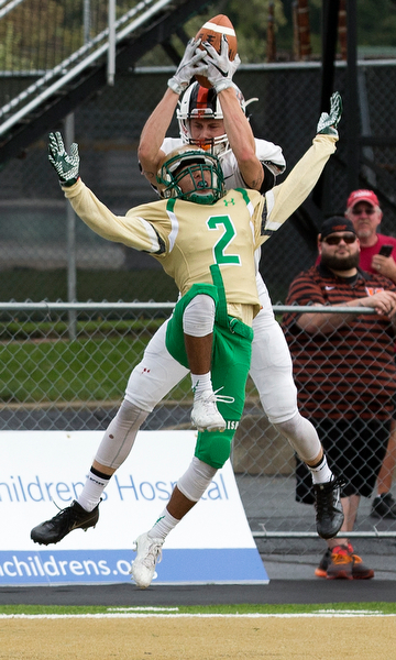 MICHAEL G TAYLOR | THE VINDICATOR- 9-17-16- 1st qtr., Ursuline's #2 Anise Algahmee is able to prevent a TD catch by Massillon's #7 Austin Jasinski. Massillon-Washington Tigers vs Youngstown Ursuline Irish at Mollenkopf Stadium in Warren, OH.
