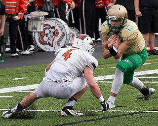 MICHAEL G TAYLOR | THE VINDICATOR- 9-17-16- Late 2nd qtr., Ursuline's #13 Jared Fabry is stopped by  Massillon's #4 Jacob Risher on the 3 yardline. Massillon-Washington Tigers vs Youngstown Ursuline Irish at Mollenkopf Stadium in Warren, OH.