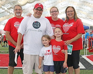 Back row) Dennis Chilesof St. Mary's, Ohio, Jason Erb of Poland, Joy Erb of Poland, Trena Chiles of St. Mary's, Ohio (front) Elinor Erb, and Emmet Erb of Poland pose for a picture as part of Team Emmet who suffers from a heart condition before the start of the Heart Walk at the WATTS on the campus of Youngstown State University on Saturday morning. Dustin Livesay  |  The Vindicator  9/17/16  WATTS