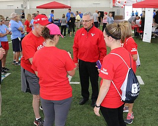 Youngstown State president Jim Tressel talks to participants before the start of the Heart Walk at the WATTS on the campus of Youngstown State University on Saturday morning. Dustin Livesay  |  The Vindicator  9/17/16  WATTS