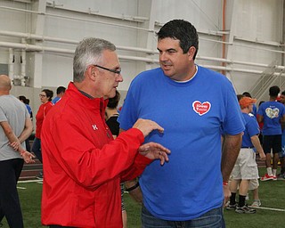 Chairman of the heart walk , Kevin Helmick (right) talks to Youngstown State president Jim Tressell before the start of the Heart Walk at the WATTS on the campus of Youngstown State University on Saturday morning. Dustin Livesay  |  The Vindicator  9/17/16  WATTS