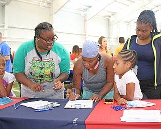 L-R) Asia Alexander, Aleyah Wilson (10), Maretta Robinson, Lalana Alexander, and Ayonna Wilson (9) all of Campbell register before the start of the Heart Walk at the WATTS on the campus of Youngstown State University on Saturday morning. Dustin Livesay  |  The Vindicator  9/17/16  WATTS