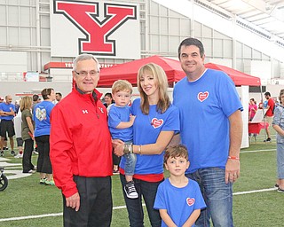 Back L-R) Youngstown State president Jim Tressell, Spencer Helmick,  Amie Helmick, Kevin Helmick, (front) and Preston Helmick pose for a picture before the start of the Heart Walk at the WATTS on the campus of Youngstown State University on Saturday morning Kevin of the Chairman of the Heart walk while Preston if the honorary heart child of the event. Dustin Livesay  |  The Vindicator  9/17/16  WATTS