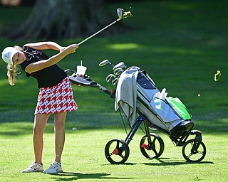 POLAND, OHIO - SEPTEMBER 19, 2016: Grace Ogden of Mooney follows though on her approach shot on the 2nd hole Monday afternoon at The Lake Club during the Christine Terlesky Benefit Golf Tournament. DAVID DERMER | THE VINDICATOR