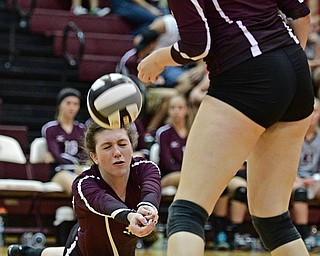 BOARDMAN, OHIO - SEPTEMBER 20, 2016: Ashley Clark #30 of Boardman falls to the floor to keep the ball alive during the third set of their match Tuesday night at Boardman High School. DAVID DERMER | THE VINDICATOR..kristen Bean #28 of Boardman pictured.