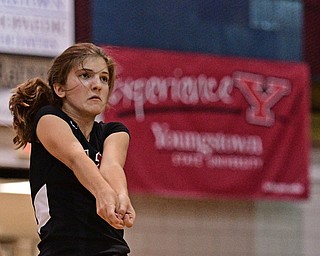 BOARDMAN, OHIO - SEPTEMBER 20, 2016: Emilie Miasek #12 of Canfield bumps the ball during the third set of their match Tuesday night at Boardman High School. DAVID DERMER | THE VINDICATOR