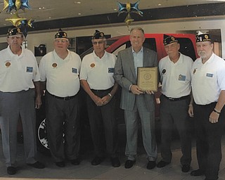 SPECIAL TO THE VINDICATOR
Members of Austintown American Legion Post 301 presented a plaque to Greg Greenwood of Greenwood Chevrolet for his assistance in advancing American Legion programs and for his support of the military, veterans and their families. From left, are Paul Robinson, Gale Reedy, Robert Kirchner, Greenwood, Harold Swoger and Sam Swoger III.