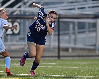 HUBBARD, OHIO - SEPTEMBER 21, 2016: Tiffany Aliberti #10 of Fitch runs after the ball after kicking it away from Cassidy Costick #17 of Hubbard during the first half of their game Wednesday night at Hubbard Memorial Stadium. DAVID DERMER | THE VINDICATOR