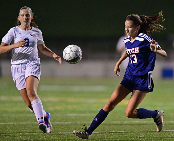 HUBBARD, OHIO - SEPTEMBER 21, 2016: Abby Knight #13 of Fitch plays the bouncing pass while sprinting in front of Kyleigh Johnson #8 of Hubbard during the first half of their game Wednesday night at Hubbard Memorial Stadium. DAVID DERMER | THE VINDICATOR