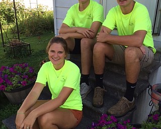 Neighbors | Submitted.Olivia Christopher, Tony Zeno (left) and Michael Phillips (right) took a well deserved break from their project.
