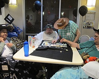 Neighbors | Alexis Bartolomucci.The black team worked on putting together their puzzle on Aug. 23 at Beeghly Oaks Rehabilitation Center to win the contest.