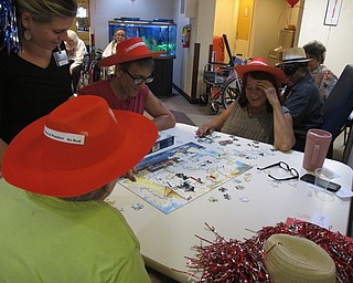 Neighbors | Alexis Bartolomucci.The red team worked together at Beeghly Oaks Rehabilitation Center on Aug. 23 to try and finish their puzzle first to win the contest.