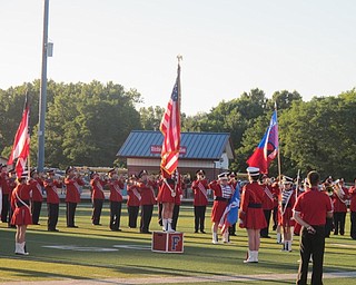 Neighbors | Alexis Bartolomucci.One of the Austintown Fitch Color Guard members stood on the Falcon box as she waved her flag while the band performed the National Anthem at the band night on Aug. 29 at Greenwood Falcon Stadium.