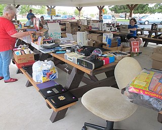 Neighbors | Alexis Bartolomucci.Guests shopped for different items that were for sale at the Trash and Treasure sale on Sept. 10 hosted by the Poland Junior Women's Club.
