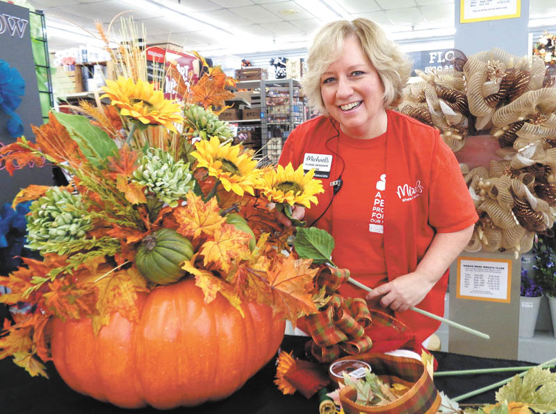 SPECIAL TO THE VINDICATOR
Florist Diane Durrant of Michaels Arts and Crafts in Boardman prepares a Halloween arrangement for St. Michael Garden Guild fundraiser, “An Evening with Five Fantastic Florists.” It will take place Tuesday at St. Michael Family Life Center in Canfield.