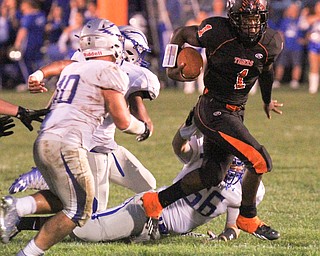 William D. Lewis/The Vindicator Howland's Samari Dean(1) scampers for yardage while being pursued by a host of Hubbard defenders during a Sept. 23,2016 game at Howland.