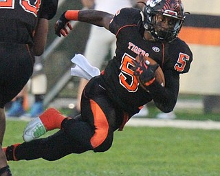 William D. Lewis/The Vindicator Howland'sTyriq Ellis(5) scampers for yardage during a Sept. 23,2016 game at Howland.