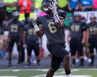 MICHAEL G TAYLOR | THE VINDICATOR- 9-23-16- 1st qtr., Harding's Jalen Hooks hauls in a 65 yard TD pass from Lynn Bowden on the 1st play from scrimmage in the game. Youngstown Ursuline Irish vs Warren G Harding at Mollenkopf Stadium in Warren, OH.