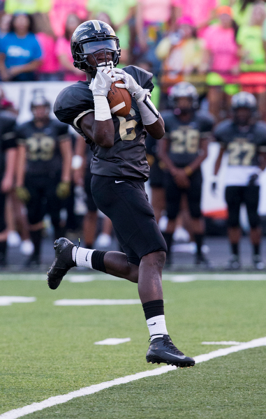 MICHAEL G TAYLOR | THE VINDICATOR- 9-23-16- 1st qtr., Harding's Jalen Hooks hauls in a 65 yard TD pass from Lynn Bowden on the 1st play from scrimmage in the game. Youngstown Ursuline Irish vs Warren G Harding at Mollenkopf Stadium in Warren, OH.