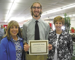 SPECIAL TO THE VINDICATOR
The 2016 Garden Forum of Greater Youngstown Area awarded Christian Moore a $1,000 scholarship on Sept. 3 at the floral show during the Canfield Fair. Moore, center, was presented the scholarship by Barbara Murray, left, scholarship chairman and third vice president, and JoAnn Vlacancich, Garden Forum president. He is a graduate of South Range High School and is in his third year at Knowlton School of Architecture at Ohio State University, where he is studying landscape architecture. He recently completed a two-month study of the National Parks Service provided by funding from OSU. He and five other students traveled to 19 states and 30 National Parks in the western United States and Canada studying landscape architecture. He also has worked at Parks Garden Center, was a Mill Creek Green Thumb volunteer and a founding horticulture adviser for Taft Grows Green community garden.