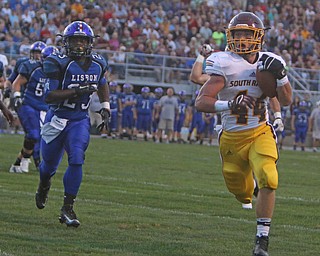 Peyton Remish (44) of South Range beats Lisbons Dougie Minor (23) to the outside scoring a touchdown during the first quarter of Friday nights matchup in Lisbon.   Dustin Livesay  |  The Vindicator  9/23/16  Lisbon.