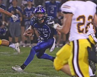 Lisbon quarterback Colin Sweeney (25) looks fort an opening in the South Range defense during the second quarter of Friday nights matchup in Lisbon.   Dustin Livesay  |  The Vindicator  9/23/16  Lisbon.