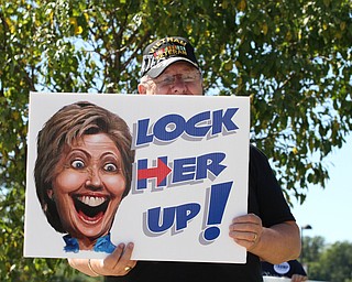 Nikos Frazier | The Vindicator..Ty Everhart of Boardman holds a "Lock Her Up!" sign outside the Covelli Centre before Chelsea Clinton and Sally Fields stumped for former Sec. of State Hillary Clinton on Saturday, Sept. 24, 2016.