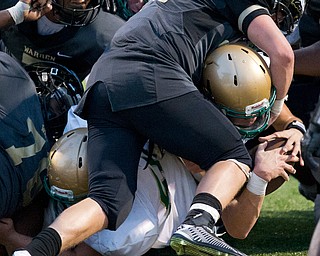 MICHAEL G TAYLOR | THE VINDICATOR- 9-23-16- 1st qtr., on 4th down, Ursuline's #13 Jared Fabry punches the ball in from the 1 yardline as Harding's #36 Collin King tries to stop him.  Youngstown Ursuline Irish vs Warren G Harding at Mollenkopf Stadium in Warren, OH.