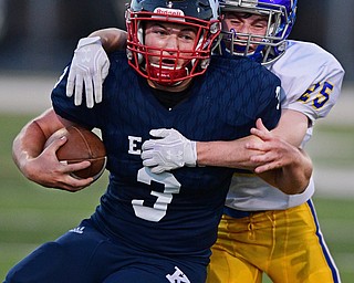 WARREN, OHIO - SEPTEMBER 24, 2016: Ross Nocera #3 of JFK is wrapped up by Brody Mihalyo #25 of Steubenville Central Catholic during the first half of their game Saturday night at Mollenkopf Stadium. DAVID DERMER | THE VINDICATOR