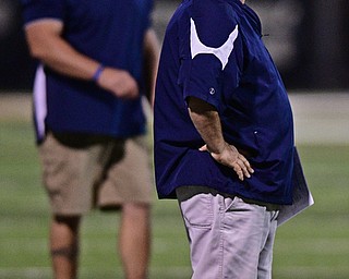 WARREN, OHIO - SEPTEMBER 24, 2016: Head coach Jeff Bayuk of JFK shows his frustration on the sideline with a first half interception thrown by JFK quarterback Gregory Valent #4 during the first half of their game Saturday night at Mollenkopf Stadium. DAVID DERMER | THE VINDICATOR