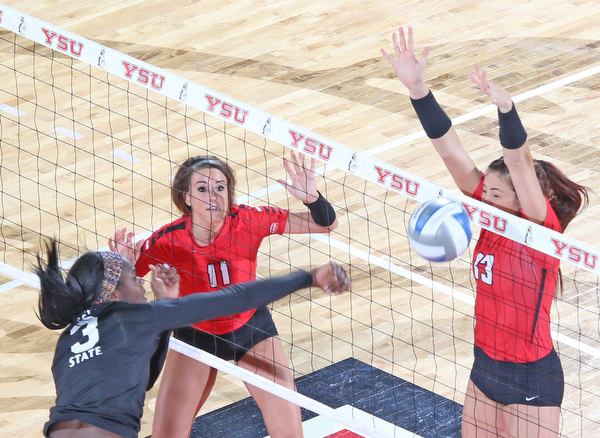 Youngstown State's Sarah Varcolla (13) blocks a spike by Cleveland State's Aaliyah Slappy (3) during the second set of Sunday afternoons matchup at the Beeghly Center.   Dustin Livesay  |  The Vindicator  9/25/16  Beeghly Center,  YSU