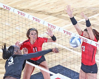 Youngstown State's Sarah Varcolla (13) blocks a spike by Cleveland State's Aaliyah Slappy (3) during the second set of Sunday afternoons matchup at the Beeghly Center.   Dustin Livesay  |  The Vindicator  9/25/16  Beeghly Center,  YSU