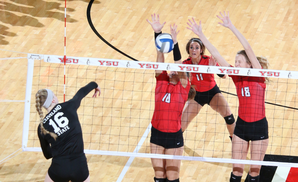 Youngstown State's Erin Kalahar (10) and Lori Vanbeek (18) block a spike by Cleveland State's Sara Skeens (16) during the third set of Sunday afternoons matchup at the Beeghly Center.   Dustin Livesay  |  The Vindicator  9/25/16  Beeghly Center,  YSU
