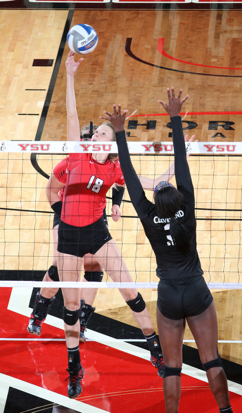 Lori Vanbeek (18) of Youngstown State hits the ball over the block set up by Clebeland State's Aaliyah Slappy (3) during the third set of Sunday afternoons matchup at the Beeghly Center.   Dustin Livesay  |  The Vindicator  9/25/16  Beeghly Center,  YSU