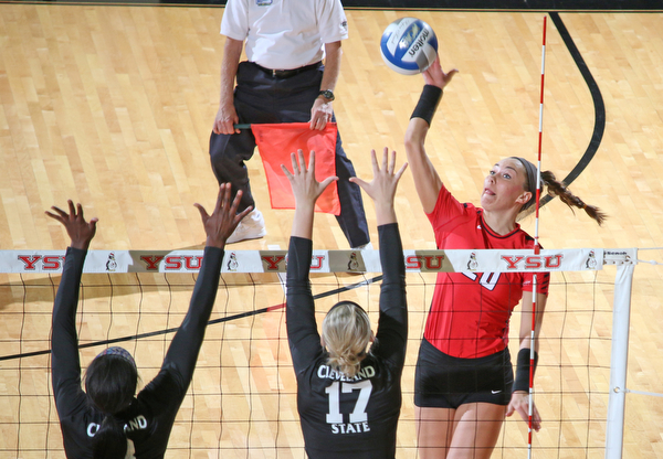 Sam Brown of Youngstown State (20) spikes the ball at the block set up by Cleveland State's Sydney Mast (17) and Aaliyah Slappy (3) during the third set of Sunday afternoons matchup at the Beeghly Center.   Dustin Livesay  |  The Vindicator  9/25/16  Beeghly Center,  YSU