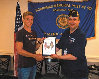 SPECIAL TO THE VINDICATOR
Dan Raver, left, a senior at Boardman High School, is congratulated by Commander John Spagnola of Boardman American Legion Post 565 for attending Boys State at Bowling Green University June 12 through 19. Boys State is a summer leadership and citizenship program sponsored by The American Legion and Auxiliary for students who are nominated by their high schools. Dante Colaluca, a senior at BHS, also participated in the program. Bowling Green has hosted the program for the past 39 years. Miami University will host the program June 11 through 18, 2017.