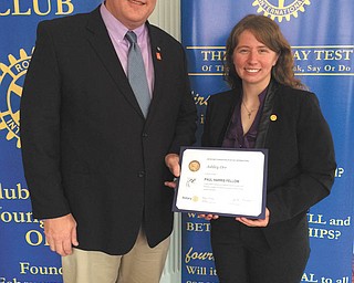 SPECIAL TO THE VINDICATOR
The Youngstown Rotary Club awarded a presidential Paul Harris Fellowship to Ashley Orr, Youngstown State University’s first Rhodes Scholar. Rotary President Bill Lawson, left, presented the award to Orr during the club’s weekly meeting Aug. 31. The award is given to Rotarians who have contributed or have had contributions made in their name of at least $1,000 to the Rotary Foundation of Rotary International. Rotarians Scott Schulick and John Slanina made the contributions in Orr’s name for her long-time association with the Rotary. Orr spoke to the Rotary about her path to the Rhodes Scholarship and her leadership and volunteer experiences while she was a YSU student. She graduated with a bachelor’s degree in mathematics and economics in May and recently completed an internship with The Rocky Ridge Neighborhood Association in Youngstown. The Paul Harris Fellowship was established in 1957 to show appreciation for substantial contributions to the Rotary Foundation. The Rotary Club of Youngstown is part of Rotary International.

