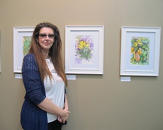 Neighbors | Alexis Bartolomucci.Vasiliki (Lilian) Filippou stood next to some of her favorite paintings that are on display at the Weller Gallery at Fellows Riverside Gardens until the end of November.