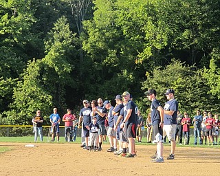Neighbors | Alexis Bartolomucci.Boardman police lined up as their names were called for the starting line-up for the Battle of the Badges baseball game on Sept. 12 at the Boardman Field of Dreams.