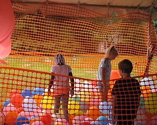 Neighbors | Alexis Bartolomucci.Children looked around in the balloon pit for tickets on the bottom during the Family Funday Carnival at Poland United Methodist Church on Sept. 17.