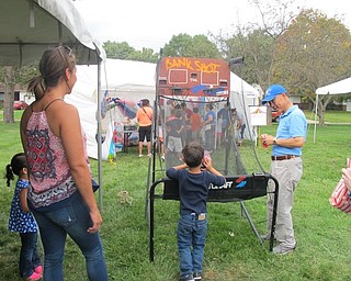 Neighbors | Alexis Bartolomucci.One of the children attending the Family Funday Carnival at Poland United Methodist Church on Sept. 17 played basketball to win tickets to buy a prize.