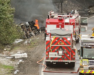        ROBERT K. YOSAY  | THE VINDICATOR..I 80 at the Belmont Ave 82/11 split eastbound lanes were closed for most of Thursday as a tanker truck flipped and caught fire .. and also burned two other vehicles.. no major injuries. . . - -30-...