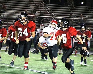 Neighbors | Submitted.Andrew Seaman (64) led Oliver Kovass (6) around the left end for a touchdown against Struthers on Sept. 21.