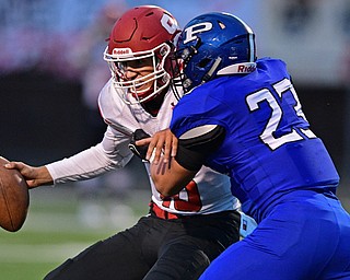 POLAND, OHIO - SEPTEMBER 30, 2016: AJ Musolino #18 of Struthers is sacked in the backfield by Alec Catsoules #23 of Poland during the first half of their game Friday night at Poland High School. DAVID DERMER | THE VINDICATOR