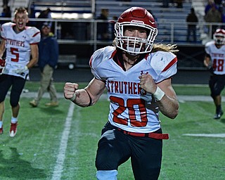 POLAND, OHIO - SEPTEMBER 30, 2016: Robbie Best #20 of Struthers pumps his fist while running off the field after defeating Poland Friday night at Poland High School. DAVID DERMER | THE VINDICATOR