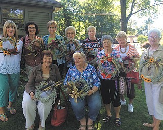 SPECIAL TO THE VINDICATOR
The 55-year-old Garden Gate Garden Club met recently at The Willows by Wehr, Columbiana. Members made dried candle ring crafts and participated in a two-hour lesson hosted by Jenny Wehr, the owner and principle florist of the company. Wehr discussed the proper care of indoor plants and blooming orchids. Members participating in the session, in front, are Theresa Cicuto, left, and Geri Tarka, and in back are Barb Murray, Michele Wrikeman, JoAnn Vlacanich, Dorothy Shirilla, Arletta Webber, Marcella Depinto, Louise Vett and Dorothy Granchie.